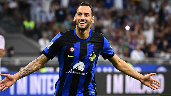 Liverpool player in a red jersey runs on the field during a match, channeling the intensity of Serie A stars like Chiesa.