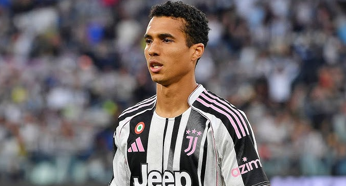 Juventus defender Costa, wearing the black and white jersey, stands on the field during a match against Porto.