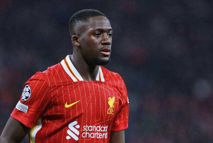 Liverpool’s Konate, in a red jersey, looks focused during a match against Real Madrid.
