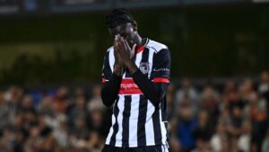 Grimsby Town midfielder Clarke Oduor playing against Manchester United in Carabao Cup 2025