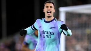 Gabriel Martinelli wearing Arsenal home kit 2025 on pitch